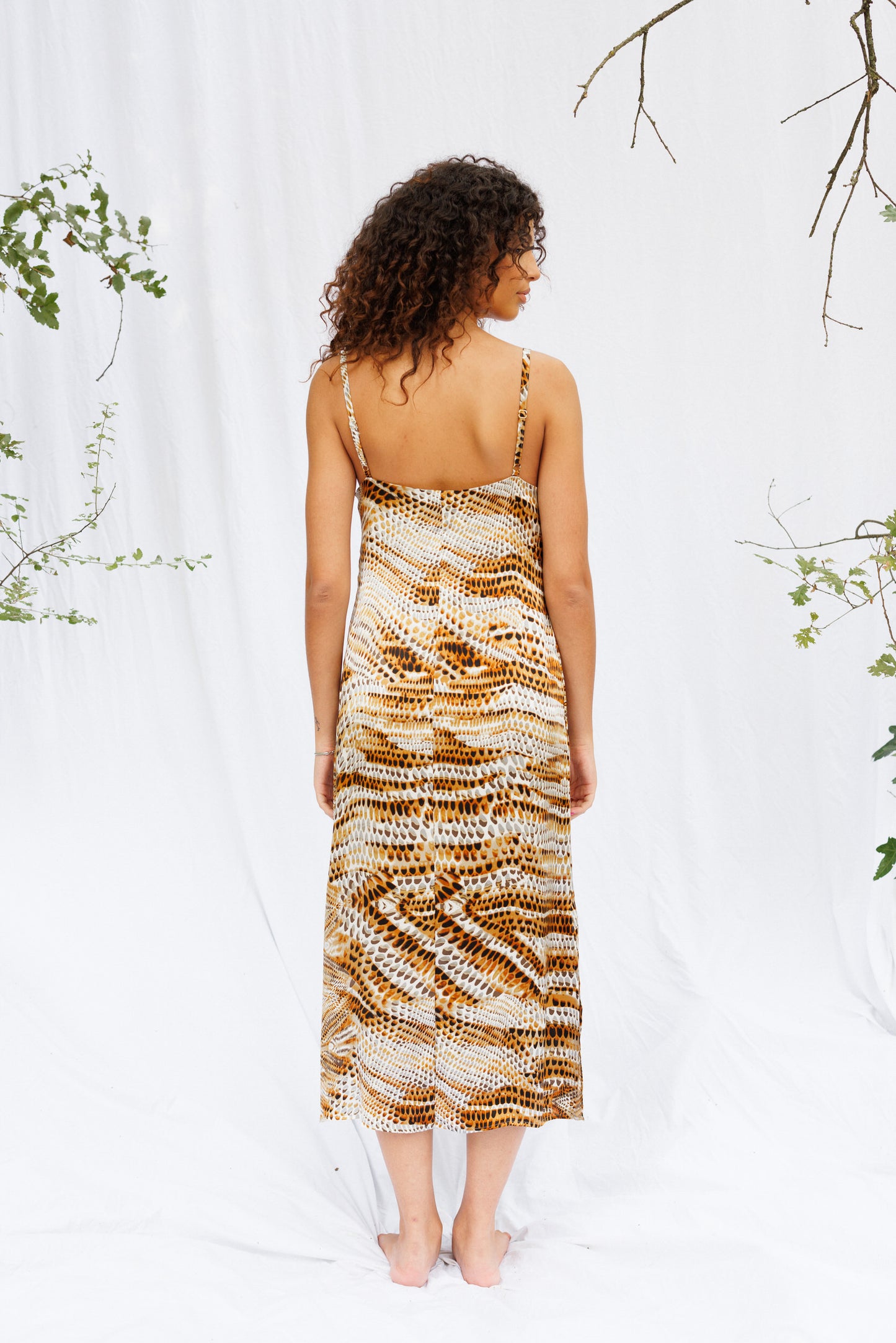Back image of Maria in a snake print slip dress
