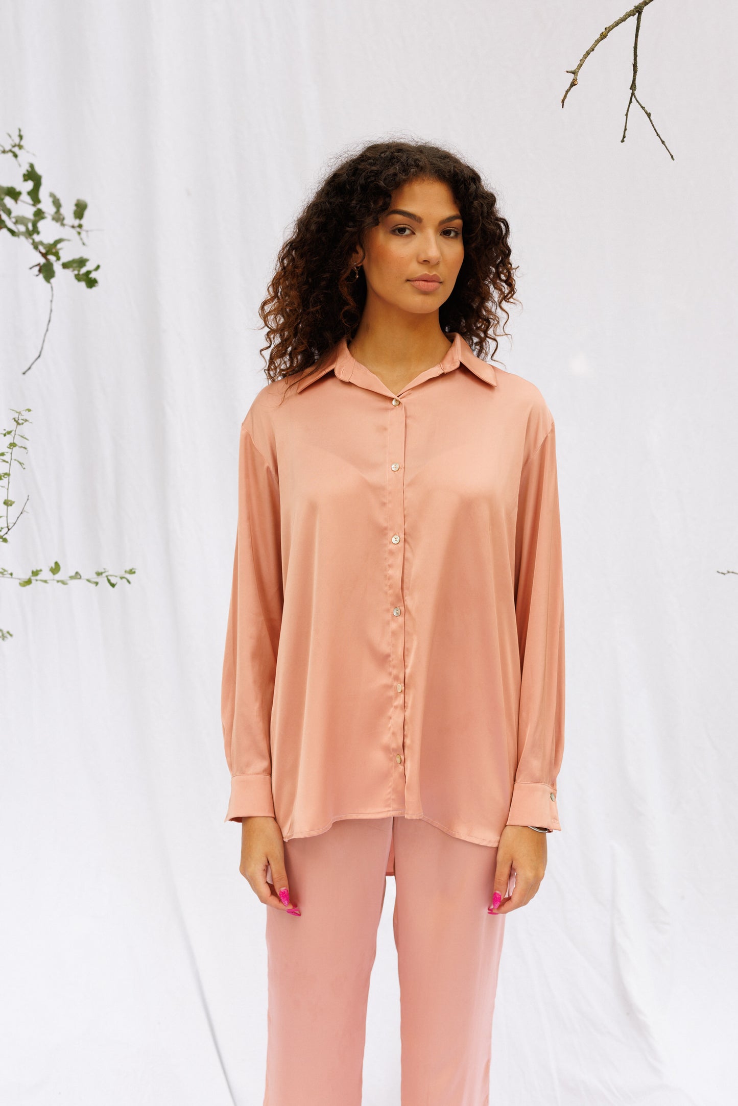 Closer front picture of Maria wearing pink oversized set