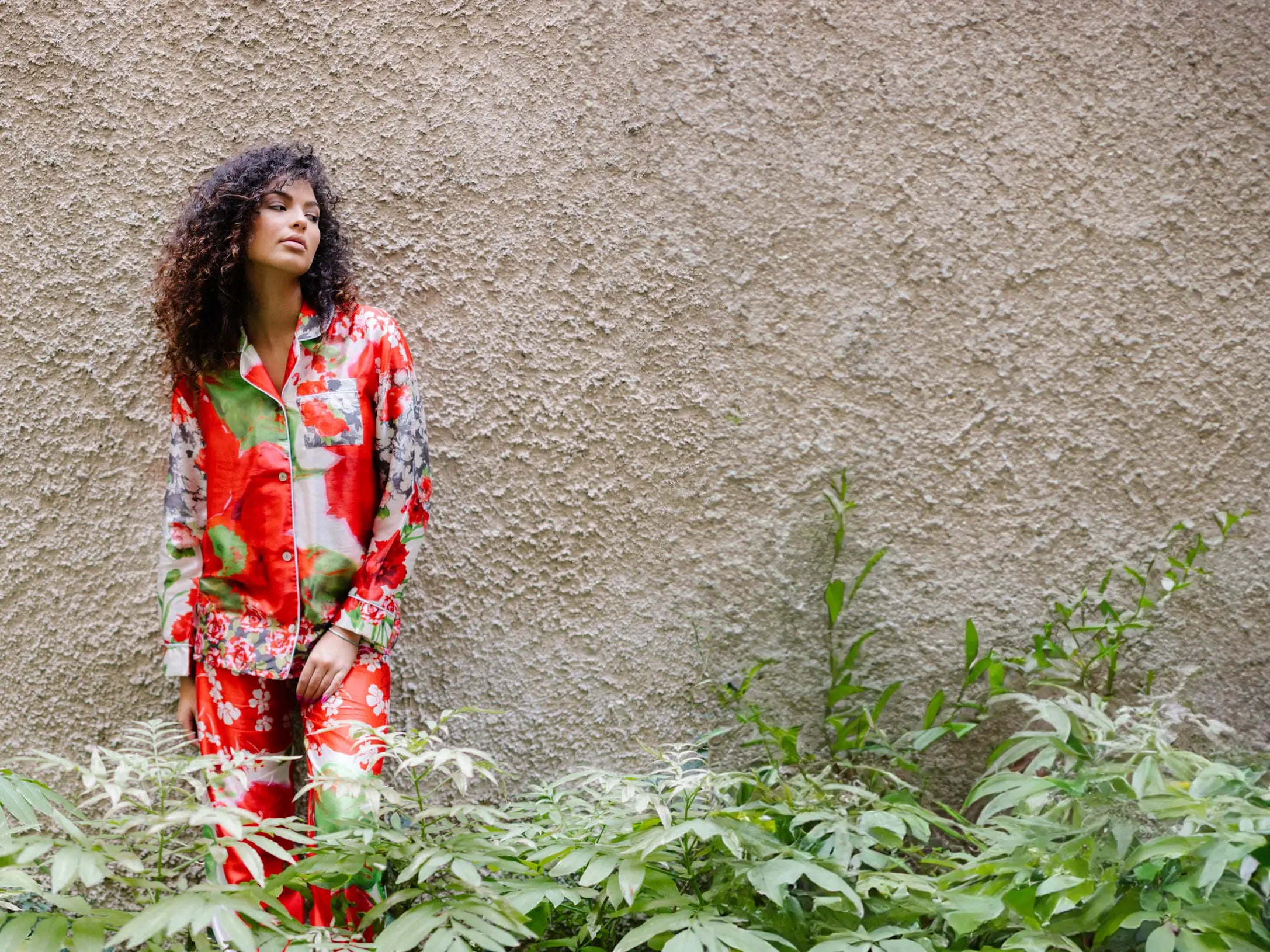 Maria wearing red printed silk pyjama set